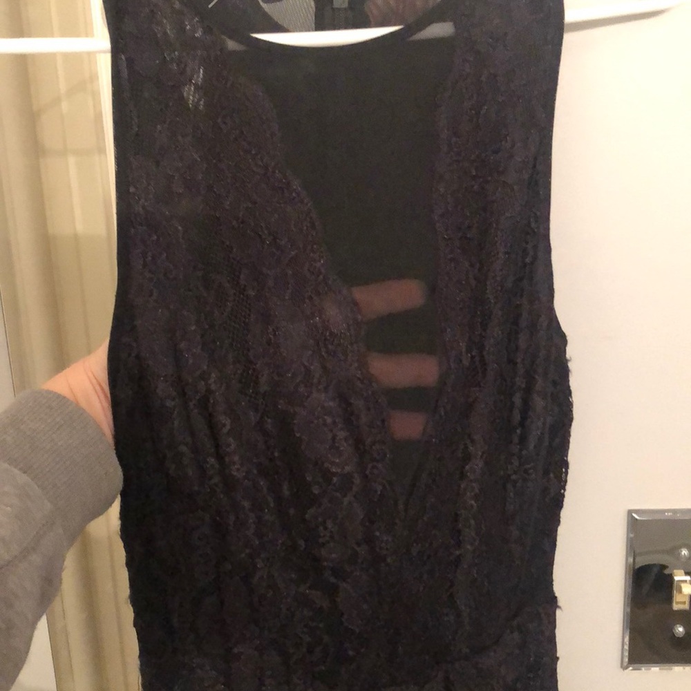 New Bebe dress with sheer back. New with tags